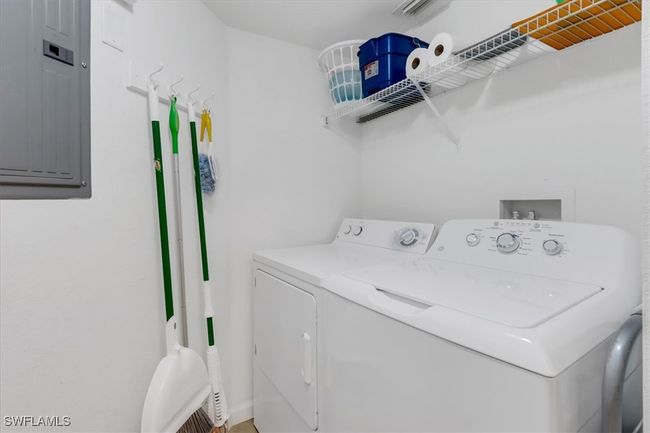 Laundry room with electric panel and independent washer and dryer | Image 20
