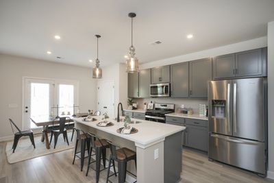 Wide open kitchen including large island! Similar home, same plan. | Image 2