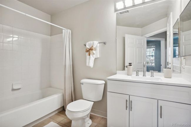 Hallway full bathroom with new vanity, counter tops, faucet and pull out shelves. | Image 22