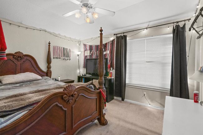 Bedroom featuring carpet and baseboards | Image 18