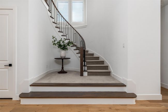 Beautiful winding stairway with understairs storage | Image 25