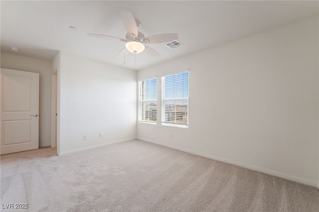 Empty room with light carpet and a ceiling fan | Image 29