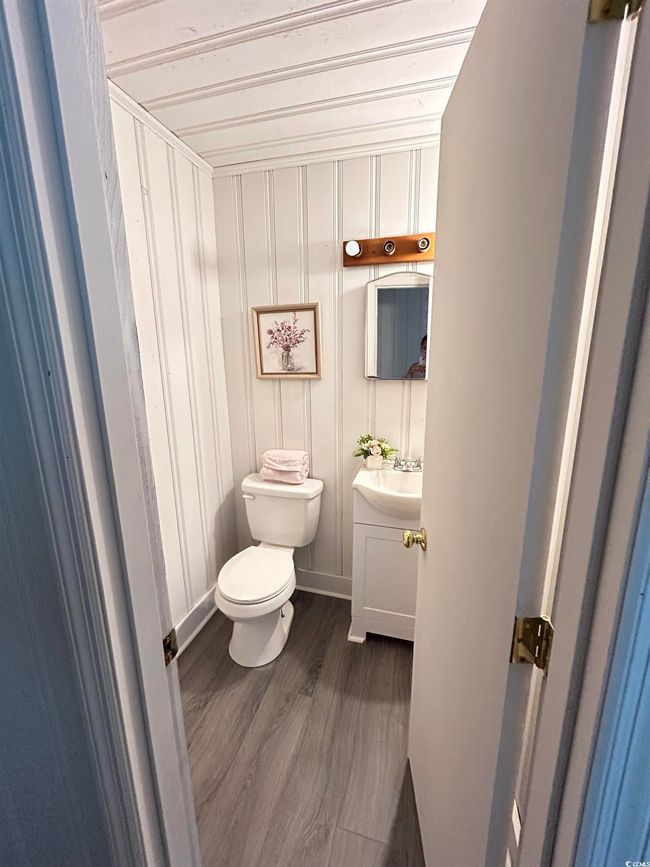 Bathroom with vanity and wood finished floors | Image 9