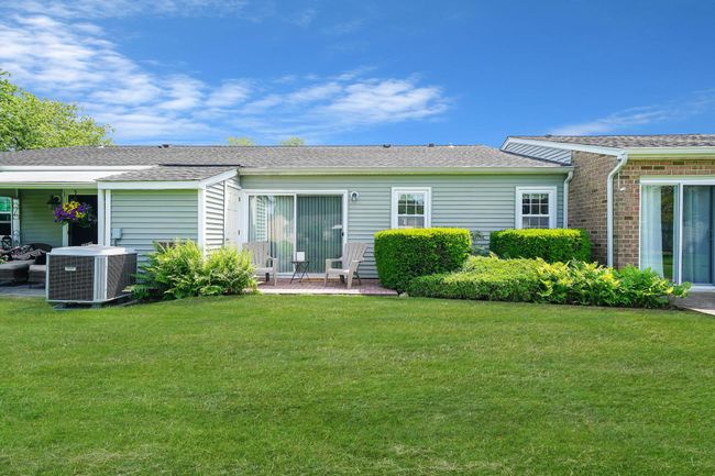 Back of house with a yard and roof with shingles | Image 18