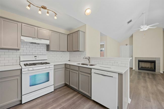 Open to living area, entertain guests while you cook! | Image 7