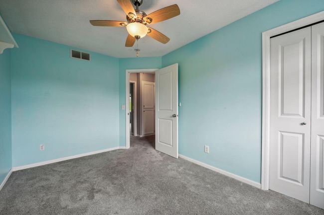 The second bedroom measures 13x9 and has an east facing window | Image 19