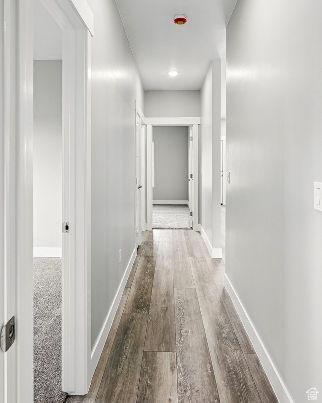 Hall with wood finished floors and baseboards | Image 34