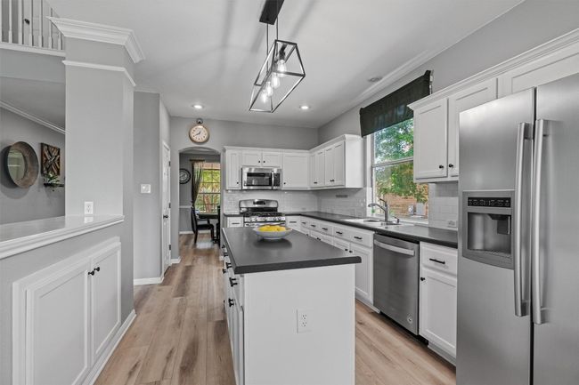 Kitchen is open to the living area. | Image 13