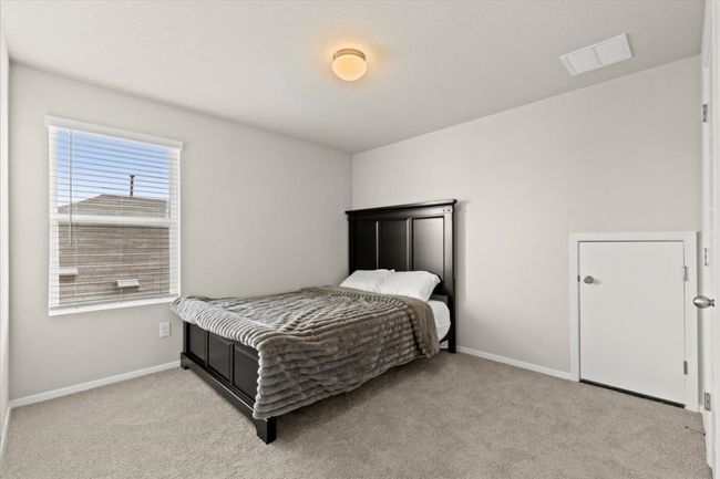 Bedroom featuring light colored carpet and baseboards | Image 25