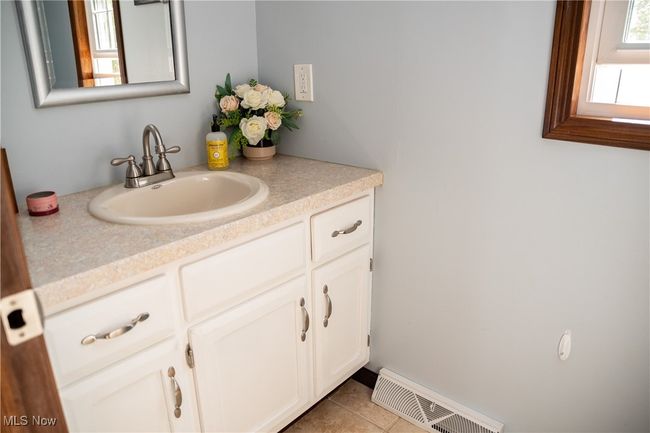Bathroom with vanity and tile patterned flooring | Image 27