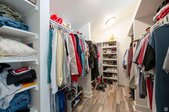 Walk in closet featuring wood finished floors | Image 31