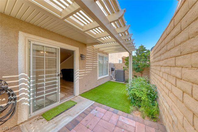 View of yard featuring a pergola and a patio area | Image 31