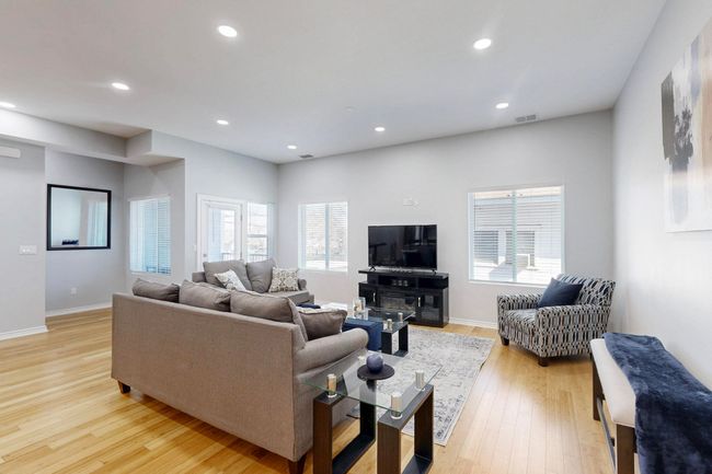 Living area featuring light wood-type flooring, recessed lighting, and baseboards | Image 8