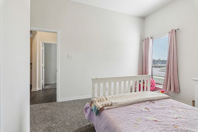 Bedroom featuring carpet flooring and baseboards | Image 23