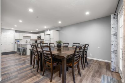 Dining space with hardwood / wood-style floors and sink | Image 2