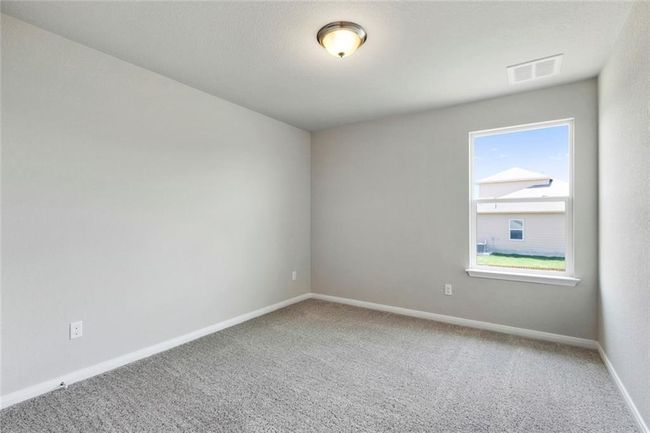 Spare room featuring carpet floors and baseboards | Image 21