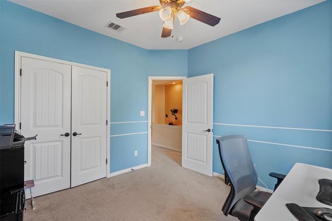 Carpeted office featuring ceiling fan and baseboards | Image 31