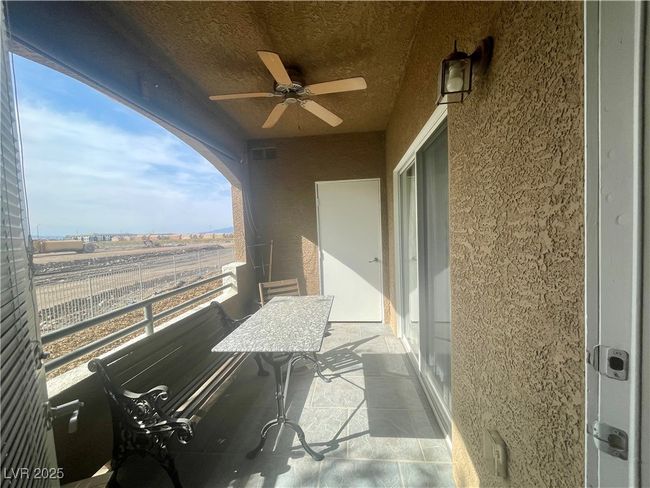 Balcony with visible vents and a ceiling fan | Image 21
