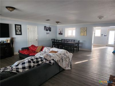 Large living open to dining area with kitchen pass thru | Image 3