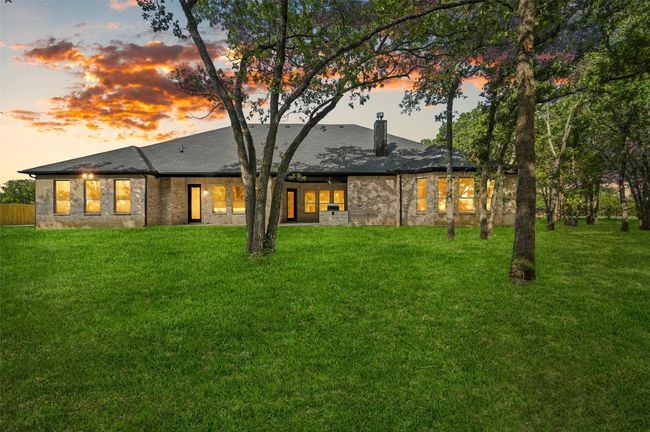 Back of property at dusk with a chimney and a lawn | Image 14