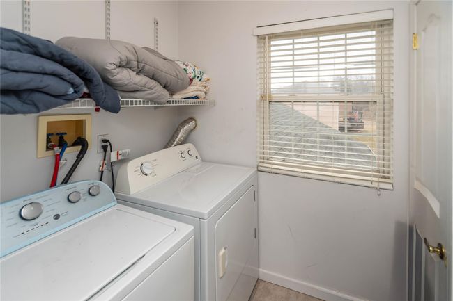 Laundry room with baseboards, independent washer and dryer, and laundry area | Image 41