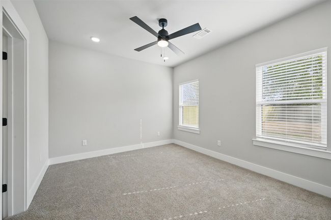 Carpeted spare room with baseboards, ceiling fan, visible vents, and recessed lighting | Image 18