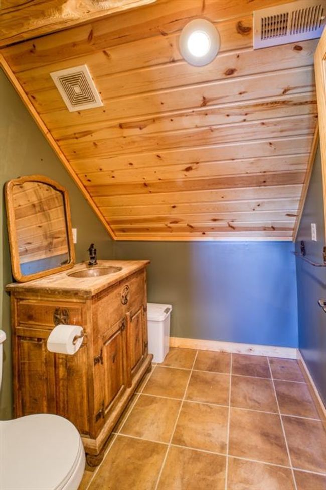 Bathroom with visible vents, toilet, vanity, and tile patterned flooring | Image 26