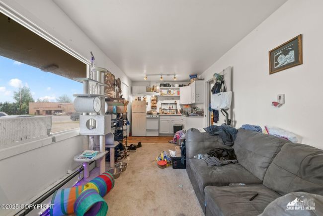 Unit 3-4 living & looking into kitchen | Image 36
