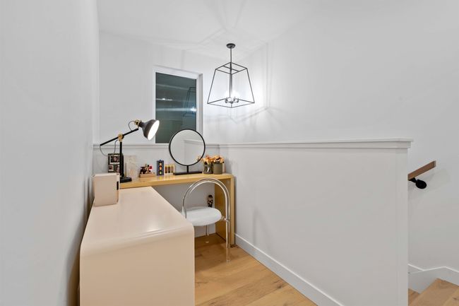 Bathroom featuring a notable chandelier and wood finished floors | Image 26