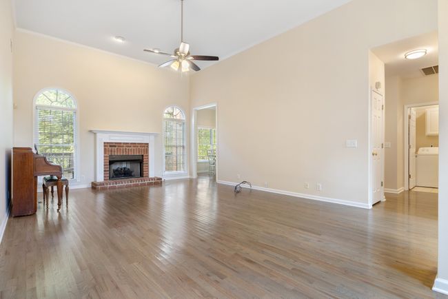 Great room off foyer and adjacent to dining room. All three rooms have high ceilings | Image 6