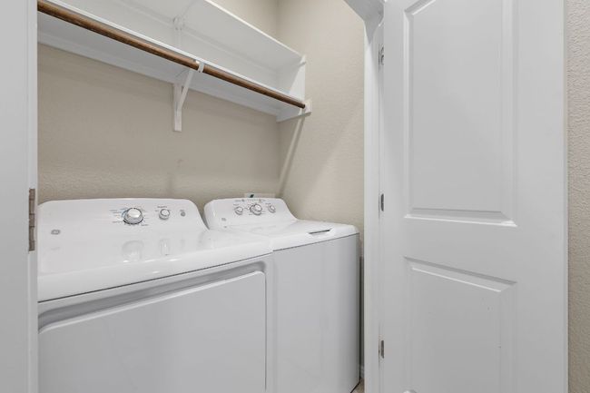 Clothes washing area featuring laundry area and separate washer and dryer | Image 24