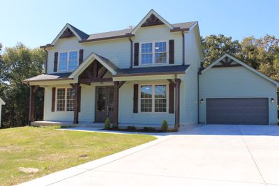 Awesome Curb Appeal with elegant covered Front entryway to welcome you and your guest. | Image 1