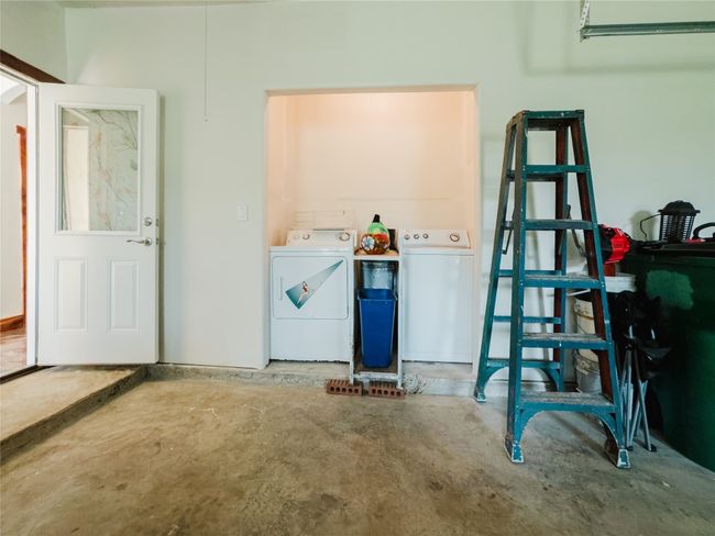 Garage with washing machine and dryer | Image 38