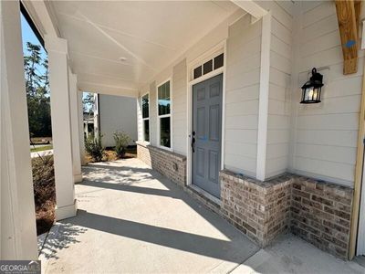 View of exterior entry featuring covered porch | Image 3