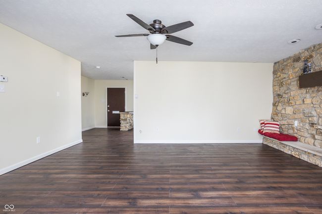 unfurnished room featuring wood finished floors and a ceiling fan | Image 5