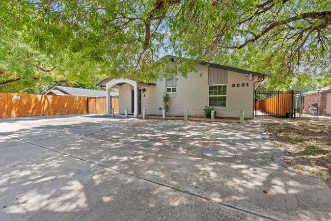 View of front of home with brick siding and a gate | Image 35