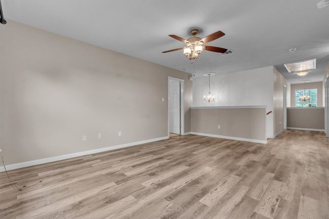 Alternate view of upstairs living area with the blue accented wall to your back | Image 15