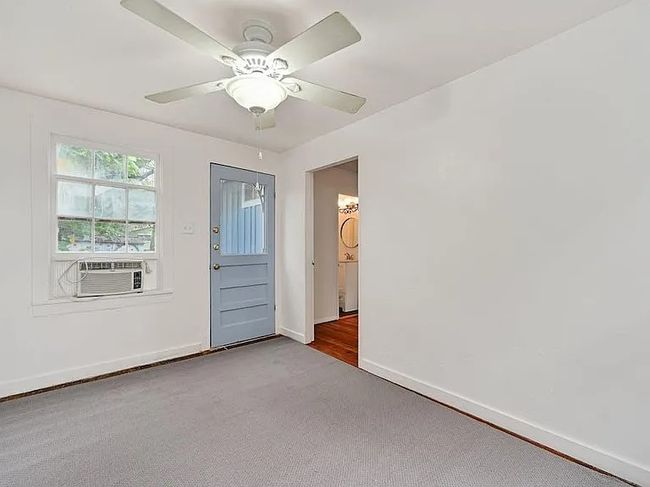 Carpeted spare room with cooling unit and ceiling fan | Image 14