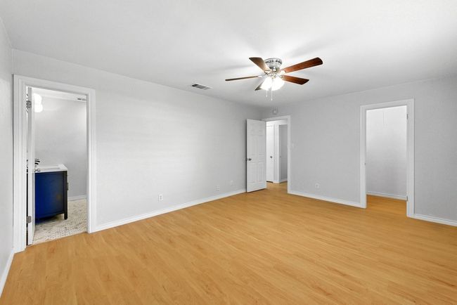 Primary Bedroom with view to en-suite full bathroom and walk-in closet | Image 27