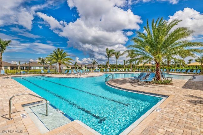 View of swimming pool with a patio area | Image 15