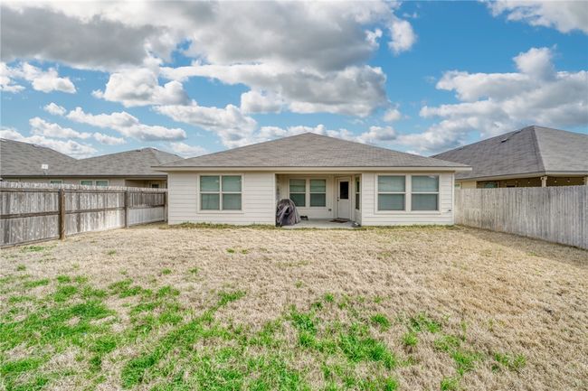Back of house featuring a yard and a patio | Image 33