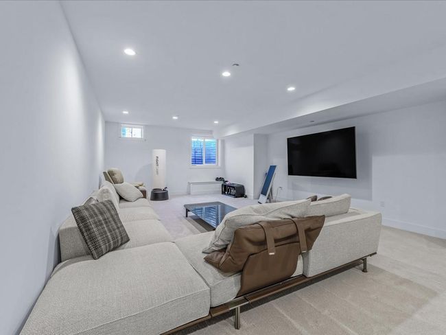 Living room with baseboards, light colored carpet, and recessed lighting | Image 18