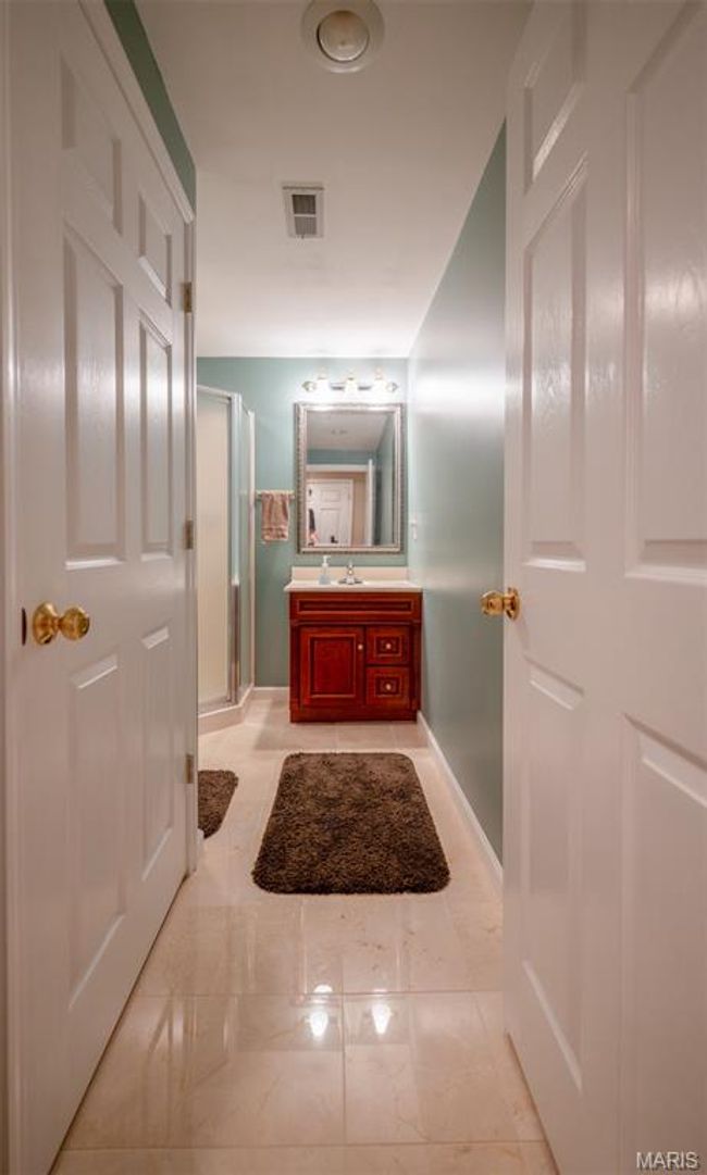 Bathroom featuring vanity and a shower stall | Image 53