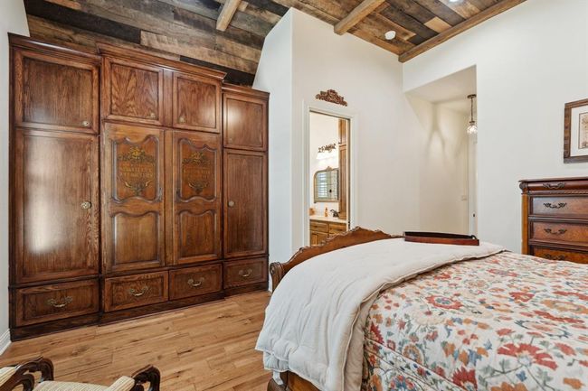 The custom-designed and crafted extra-large storagecabinet has two gorgeous antique French cupboard doors centrally incorporated. | Image 30