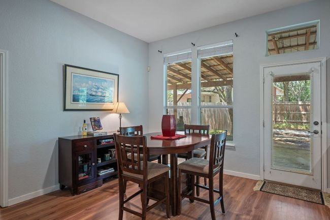 Dining area featuring wood finished floors and baseboards | Image 13