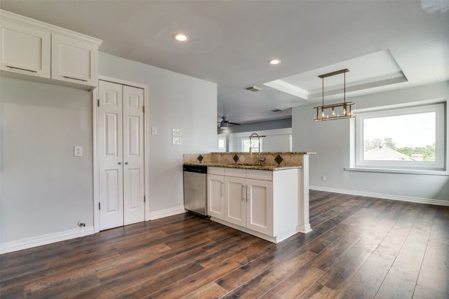 Kitchen and breakfast room with lake views. | Image 6