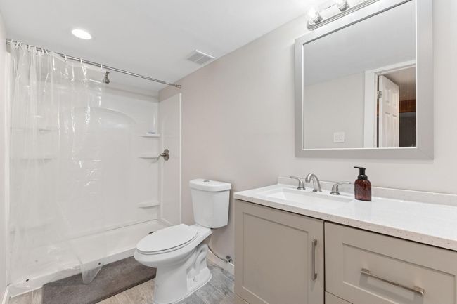 Full bath featuring vanity, a shower | Image 21