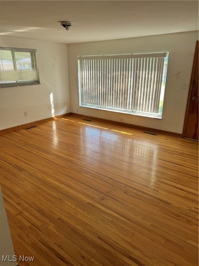 Empty room with light hardwood / wood-style flooring | Image 2