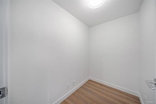 Spare room featuring wood finished floors and baseboards | Image 9