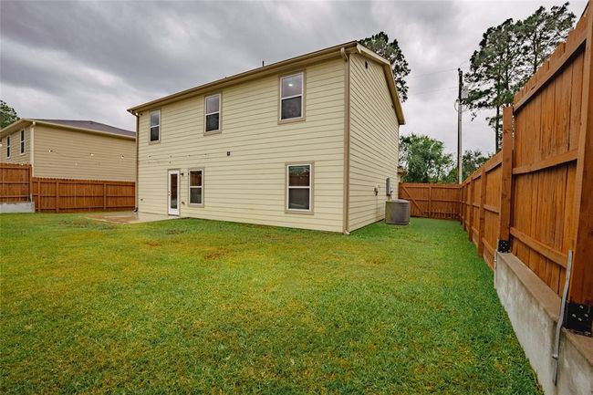 View from the opposite corner of the fully privacy fenced backyard. | Image 28